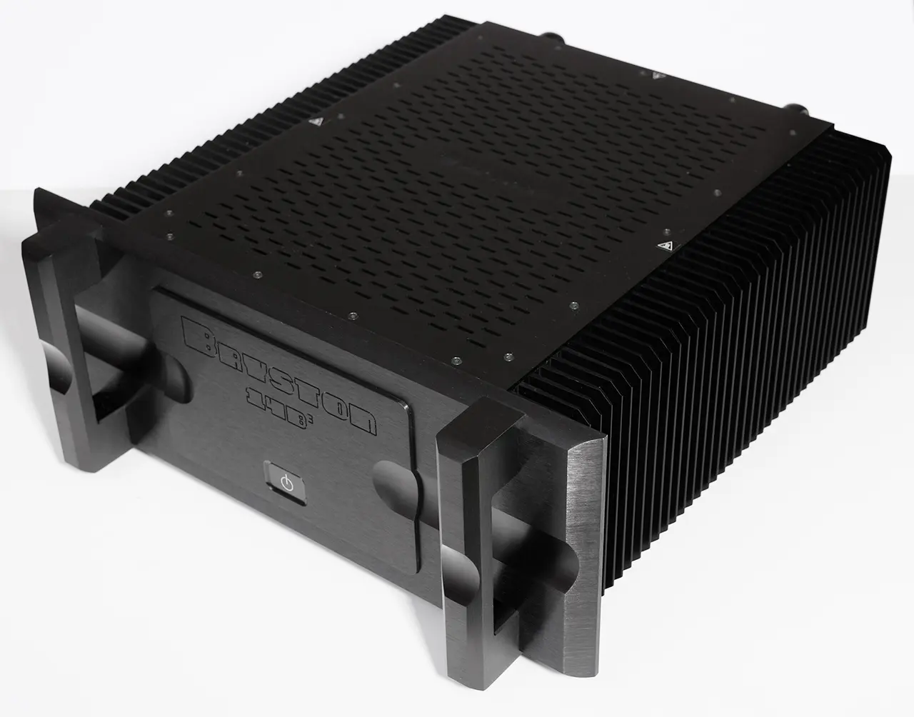 Black professional audio amplifier with cooling fins and control knobs.