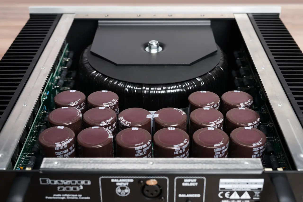 Close-up of electronic components inside a device showing capacitors and circuit board.