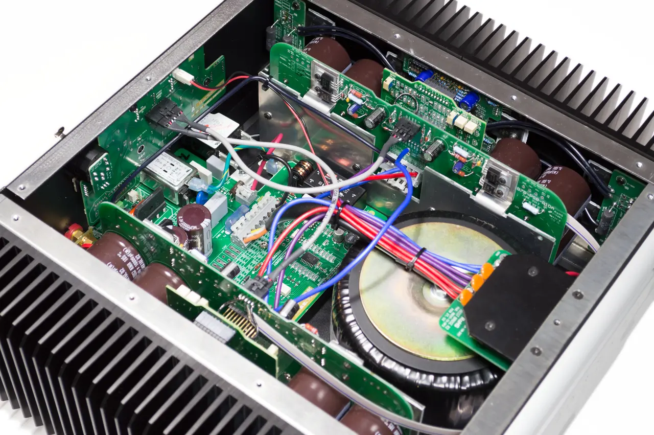 Interior view of an electronic amplifier showing complex circuitry and components.