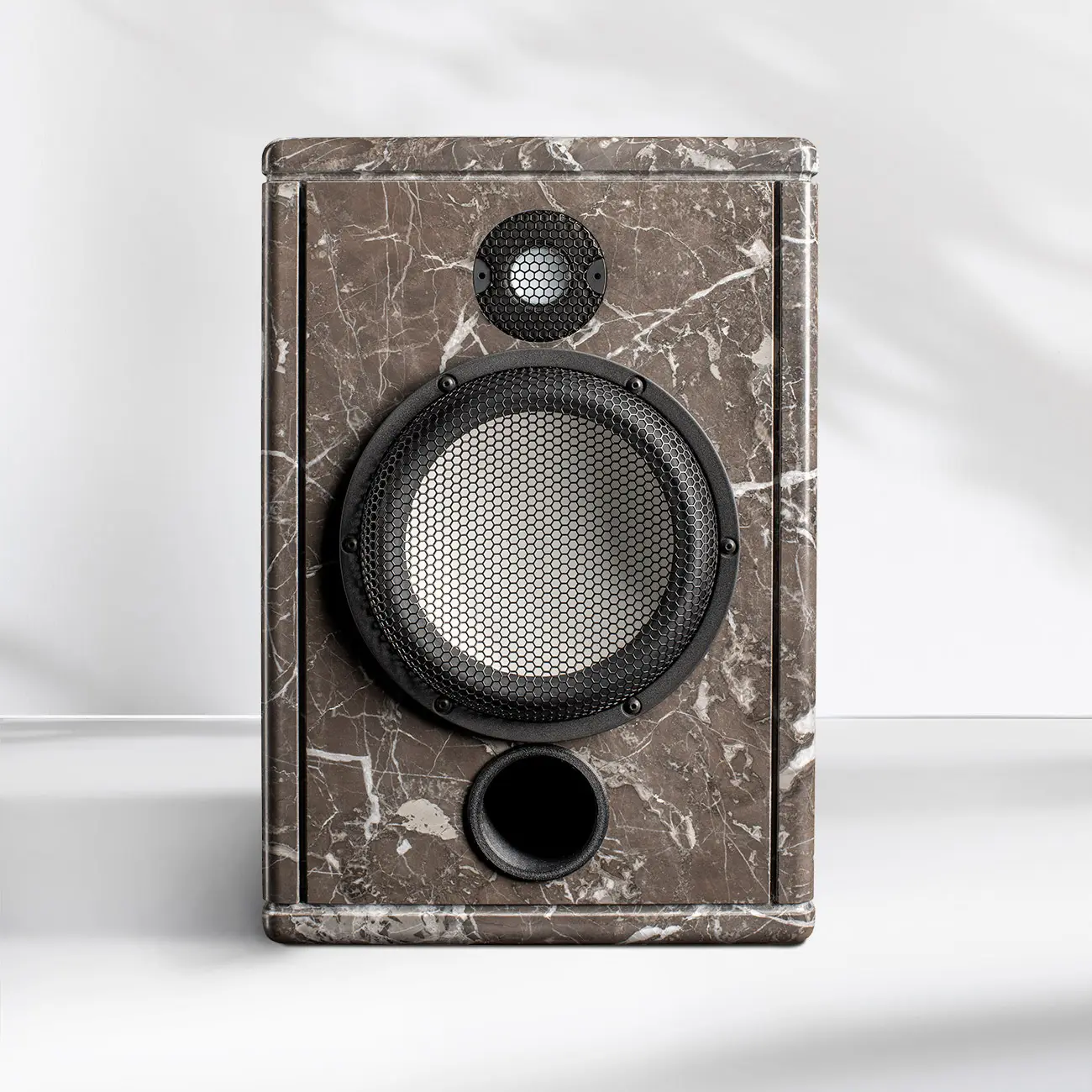 Vintage speaker with a worn wood finish and two circular openings.