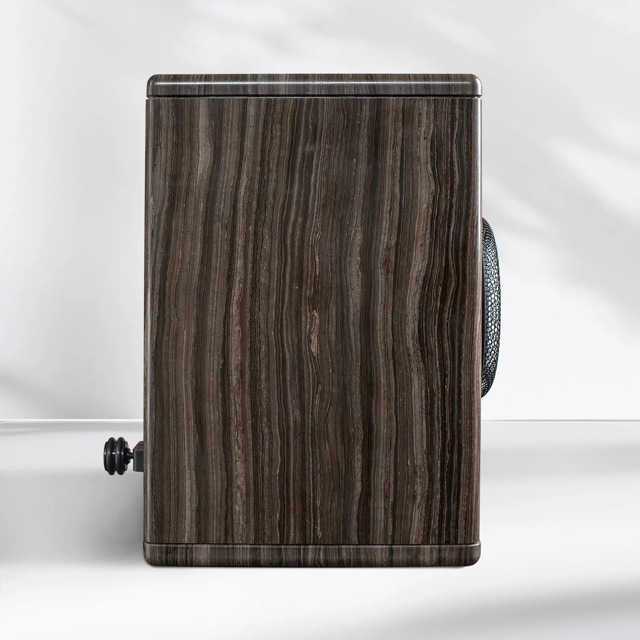 Side view of a vintage wooden camera with a focusing knob.