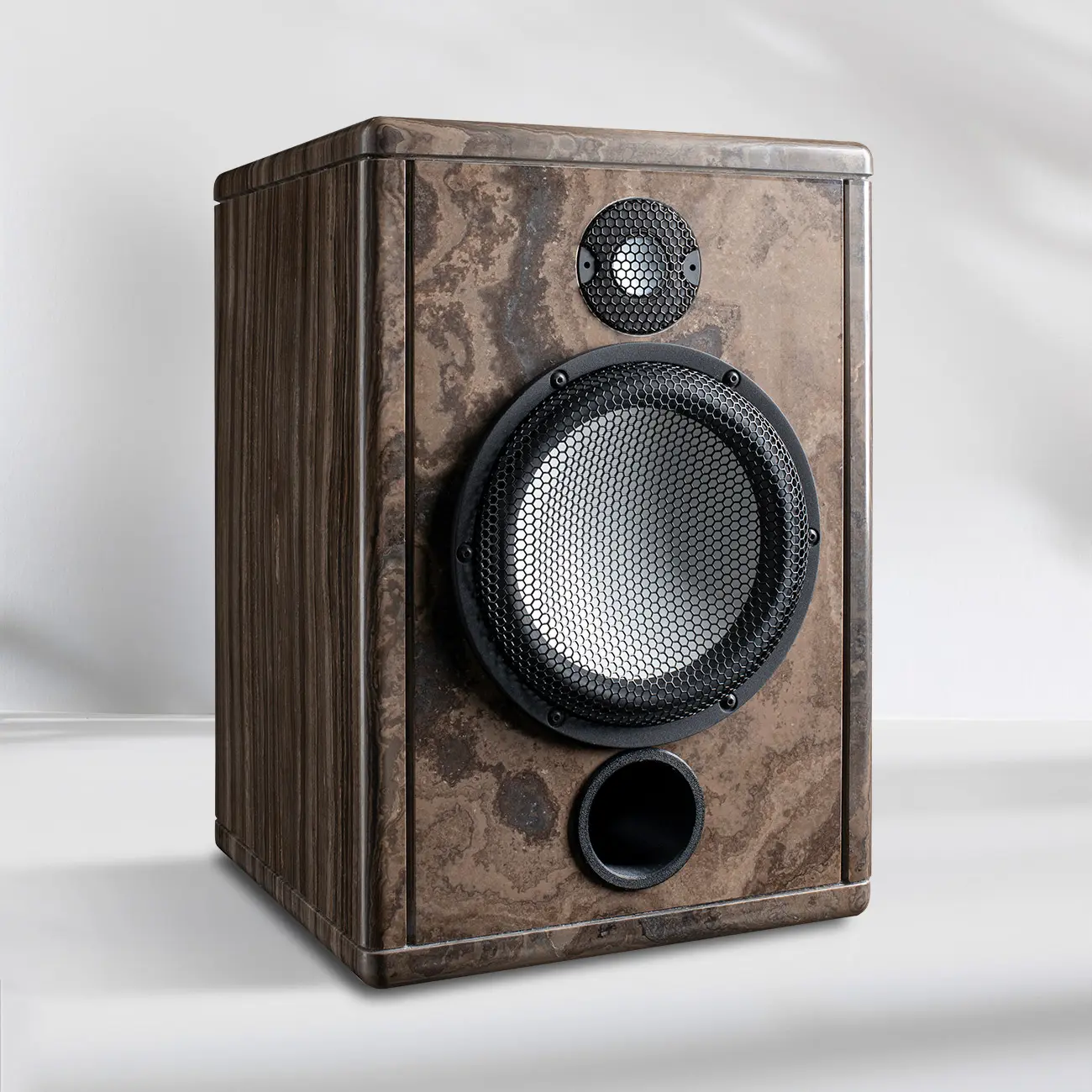 Wooden speaker with a visible woofer and tweeter on white background.