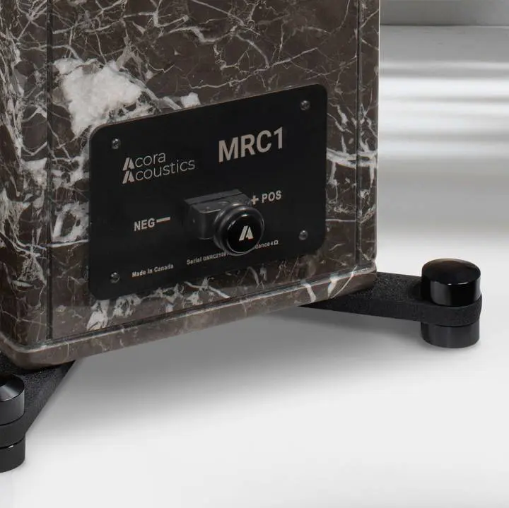 Close-up of a marble-textured MRC1 audio amplifier with control knob.