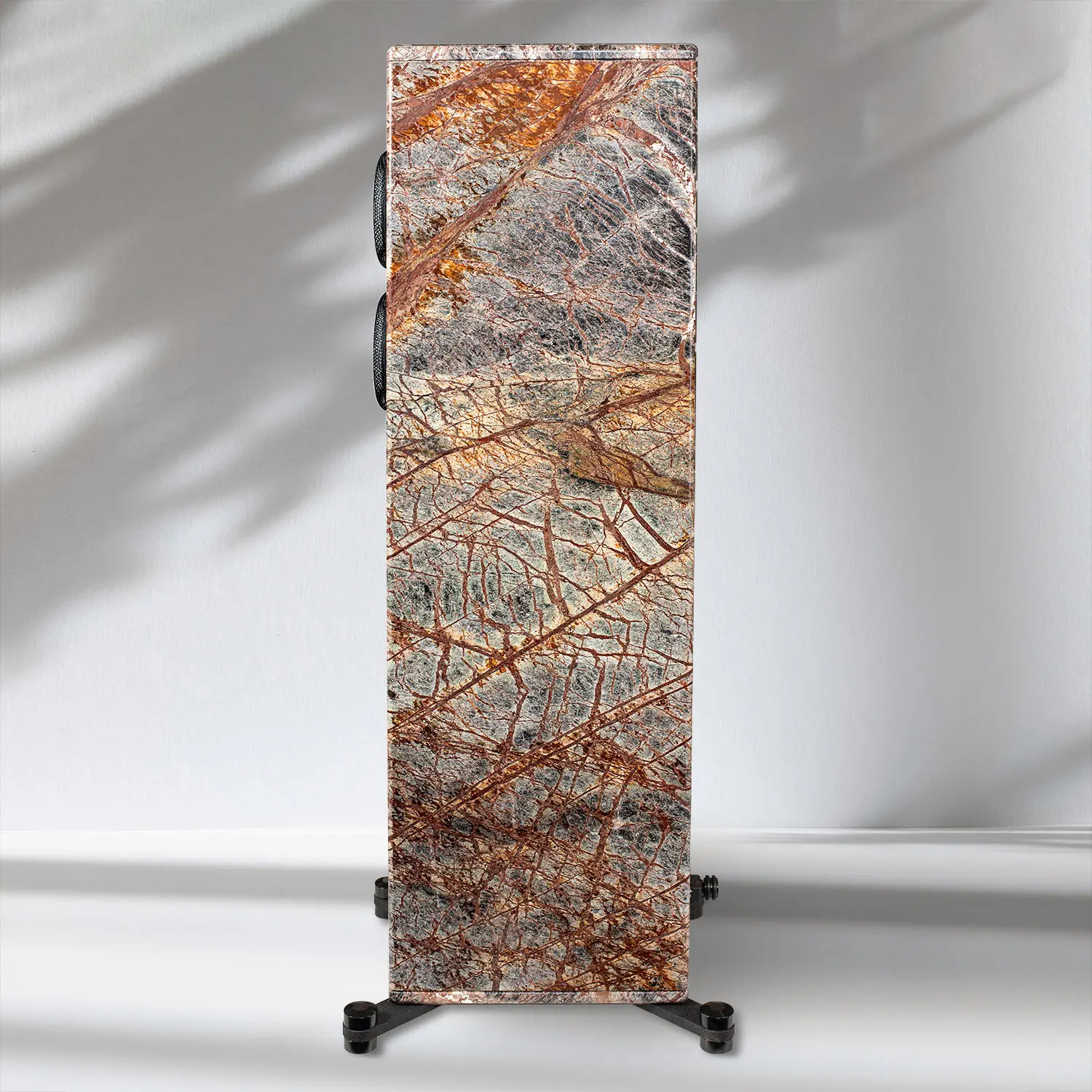 Decorative stone slab with intricate natural patterns on a stand.