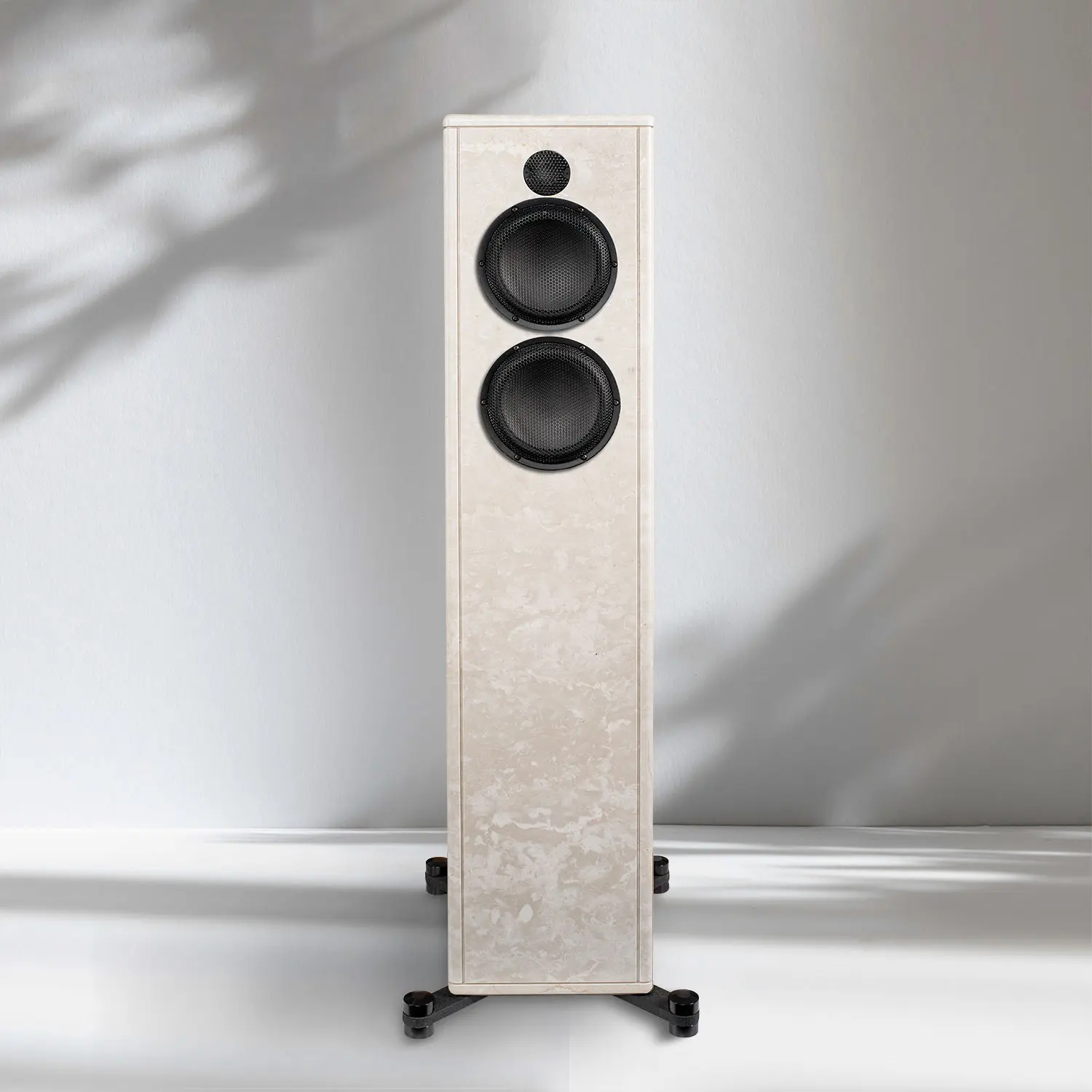 Modern floor-standing speaker with a sleek white finish and black drivers.