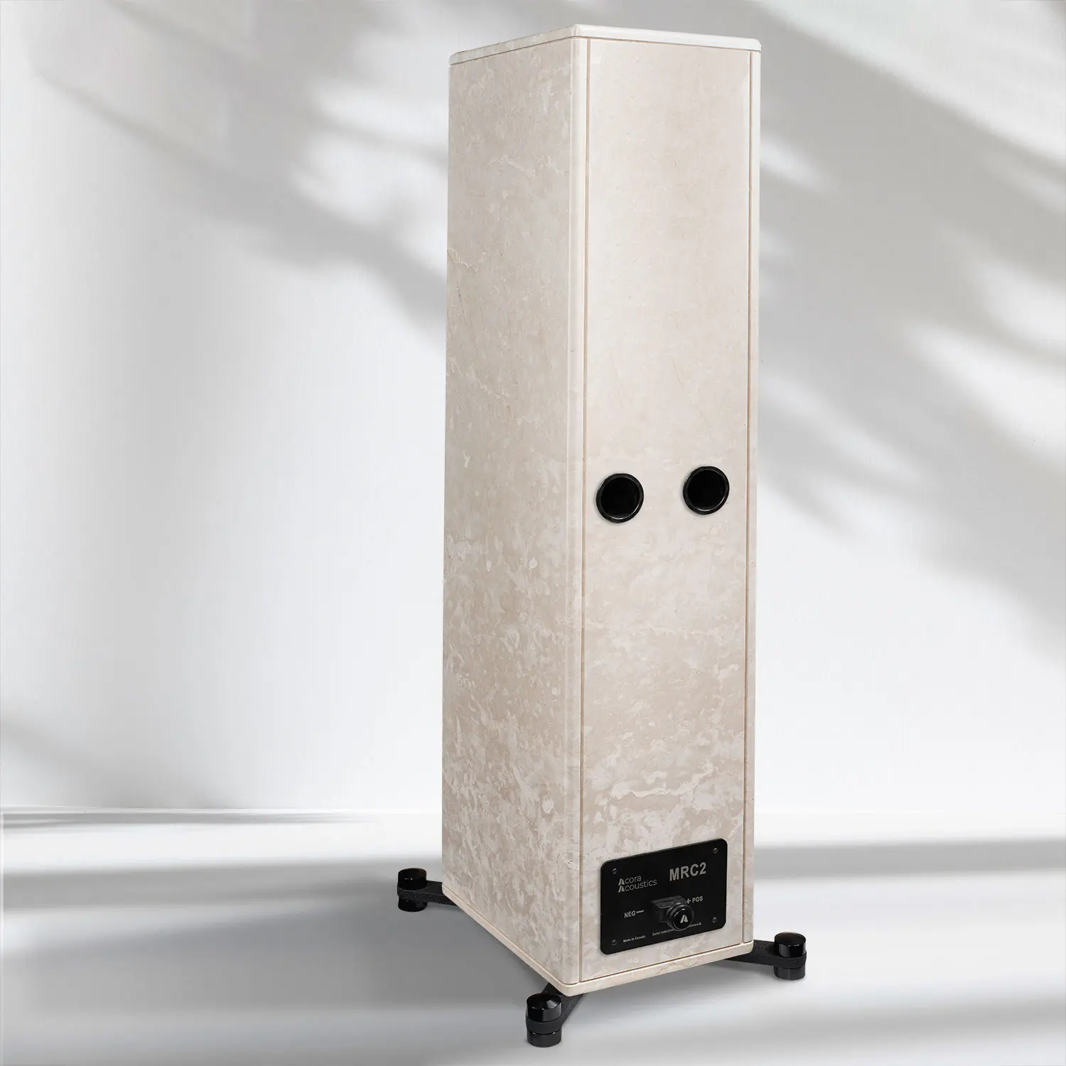 Tall beige tower speaker with black accents on wheels.