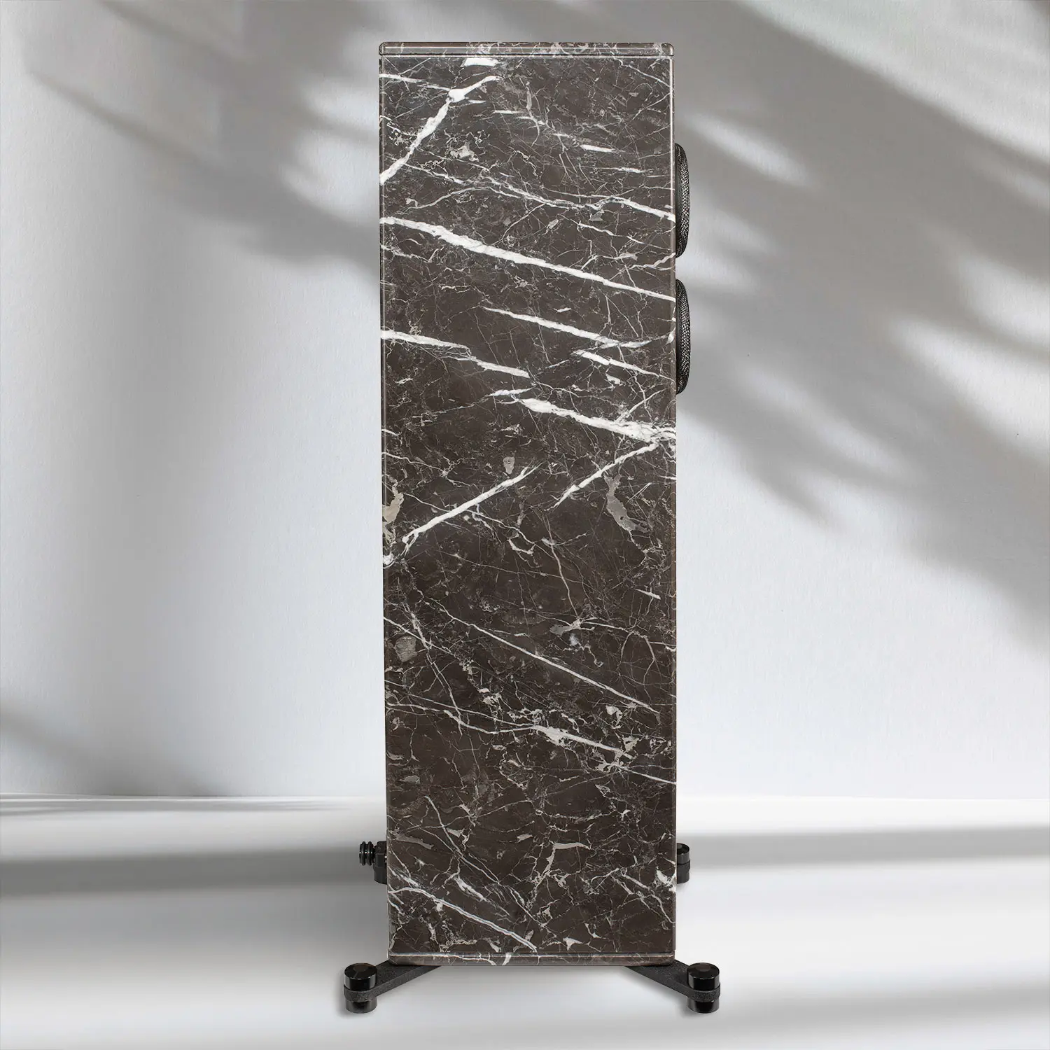 Tall rectangular brown marble slab with white veins on a stand.