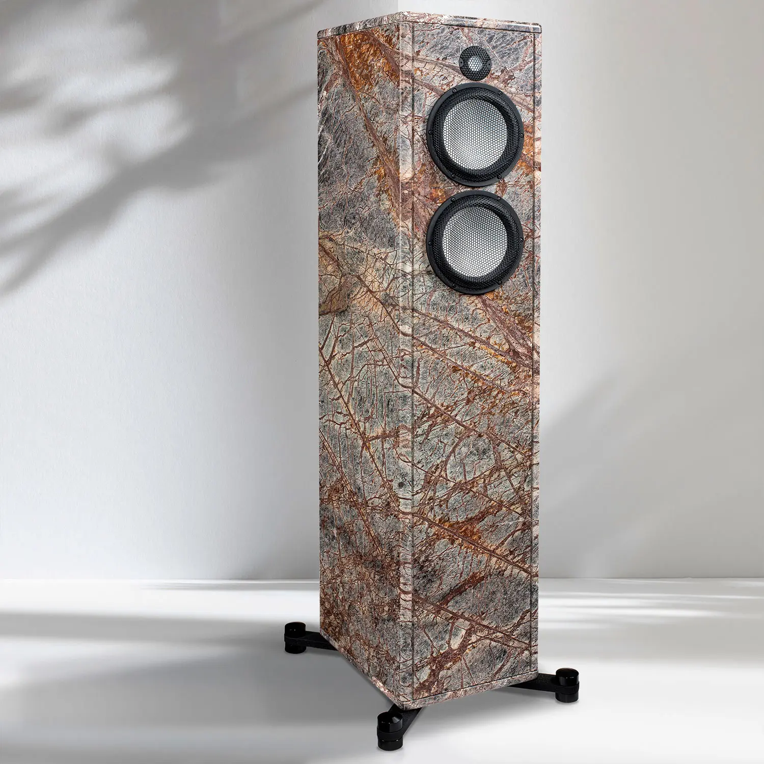 Tall speaker with a unique textured surface and two circular drivers.