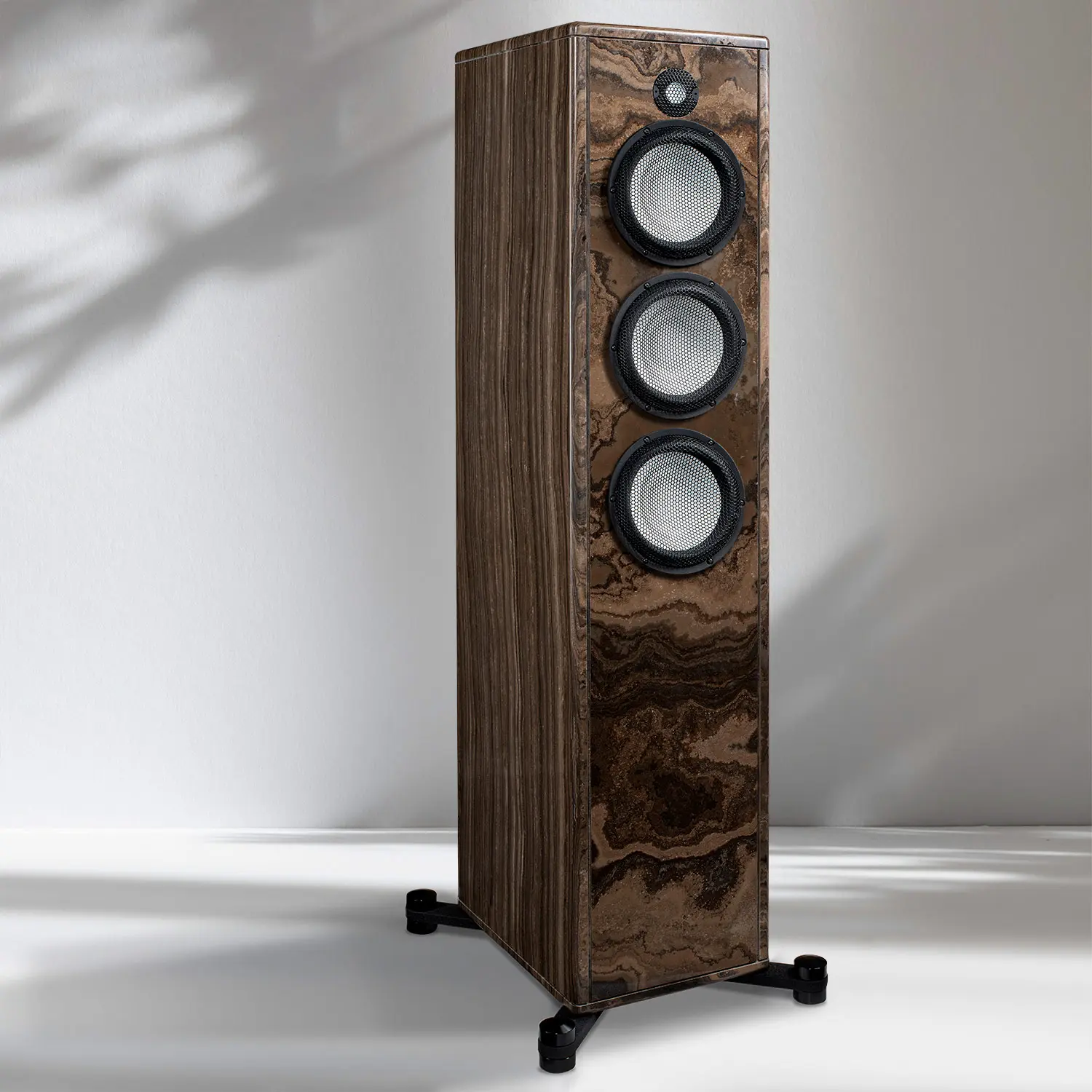 Tall wooden floor-standing speaker with three drivers and a walnut finish.
