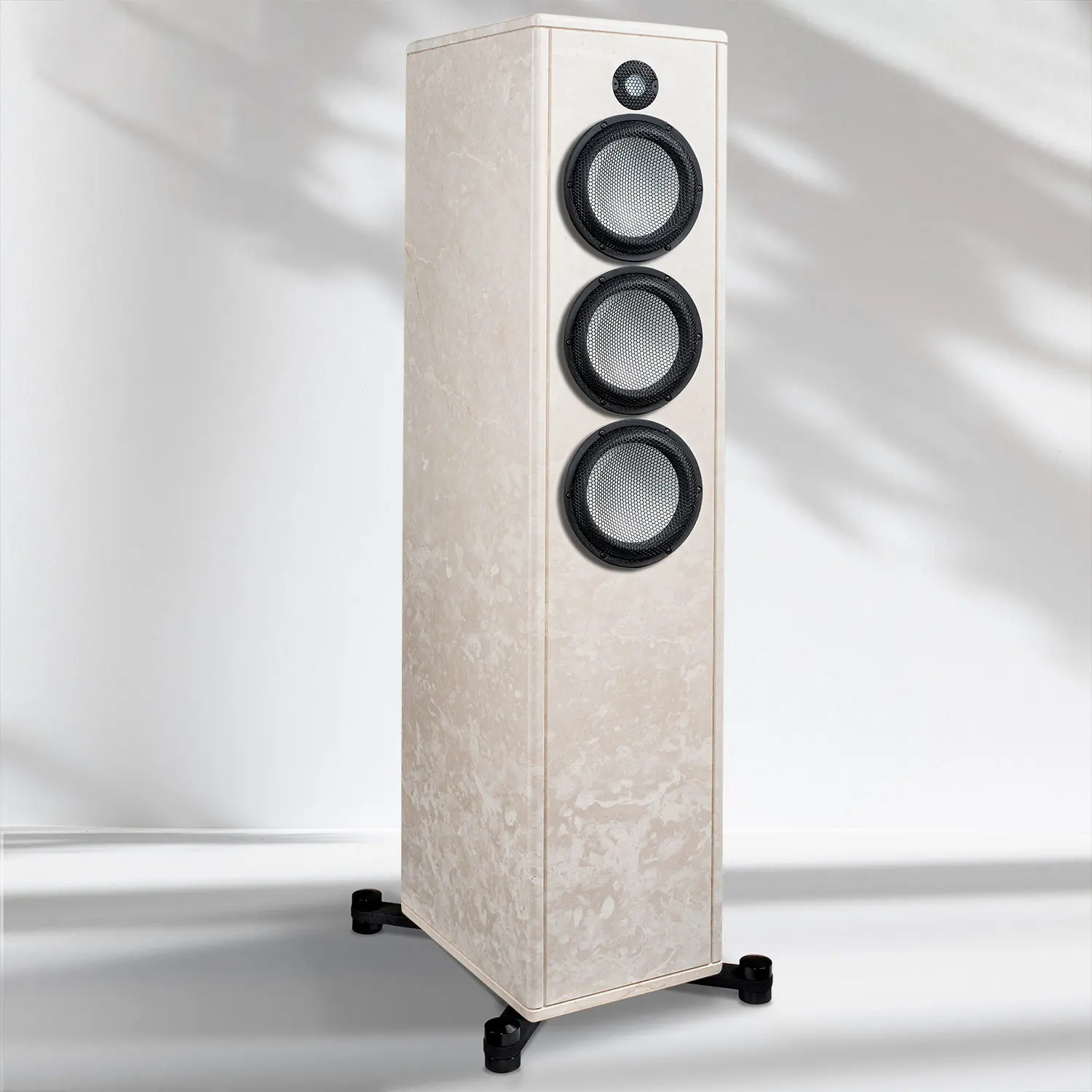 Modern floor-standing speaker with three drivers in a light wood finish.