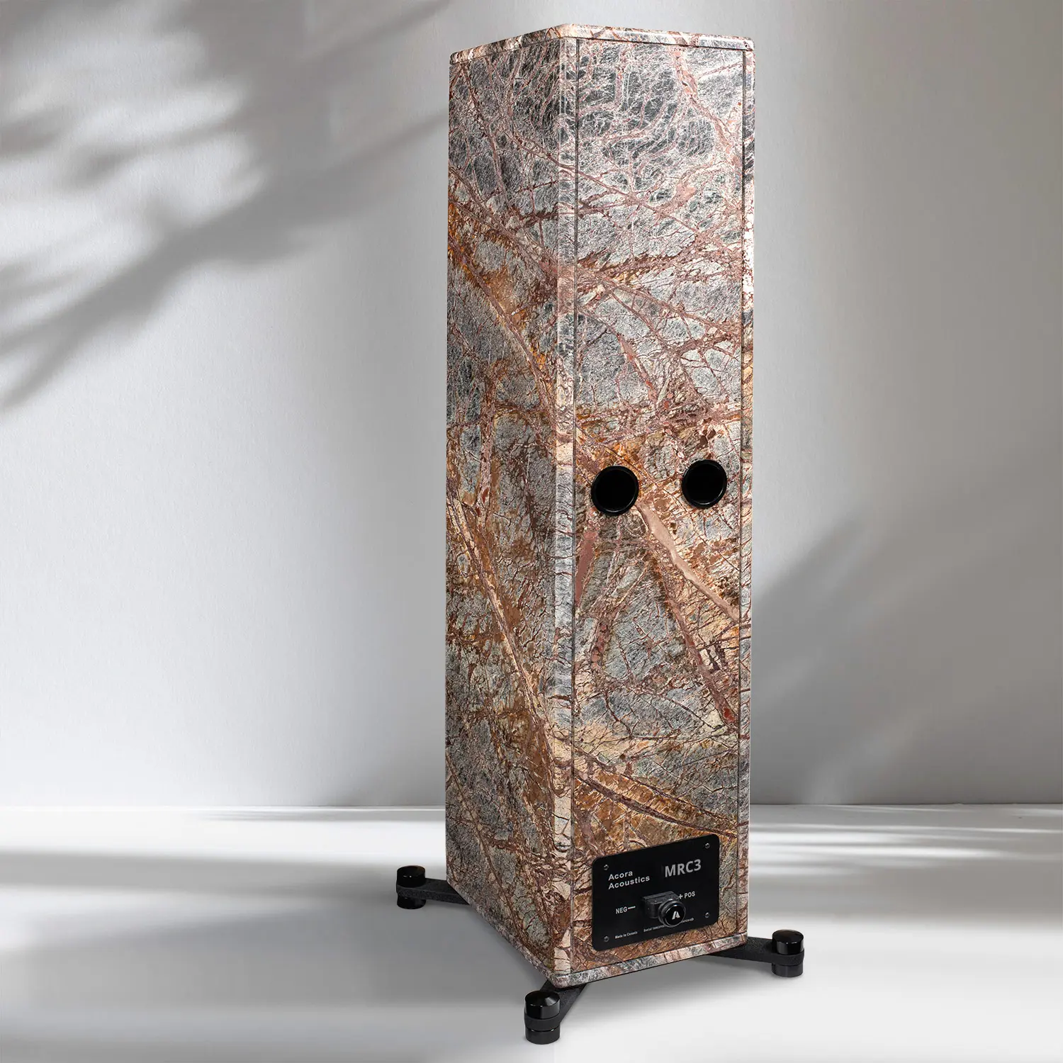 Tall, rustic wooden speaker cabinet with visible grain and two circular speaker openings.