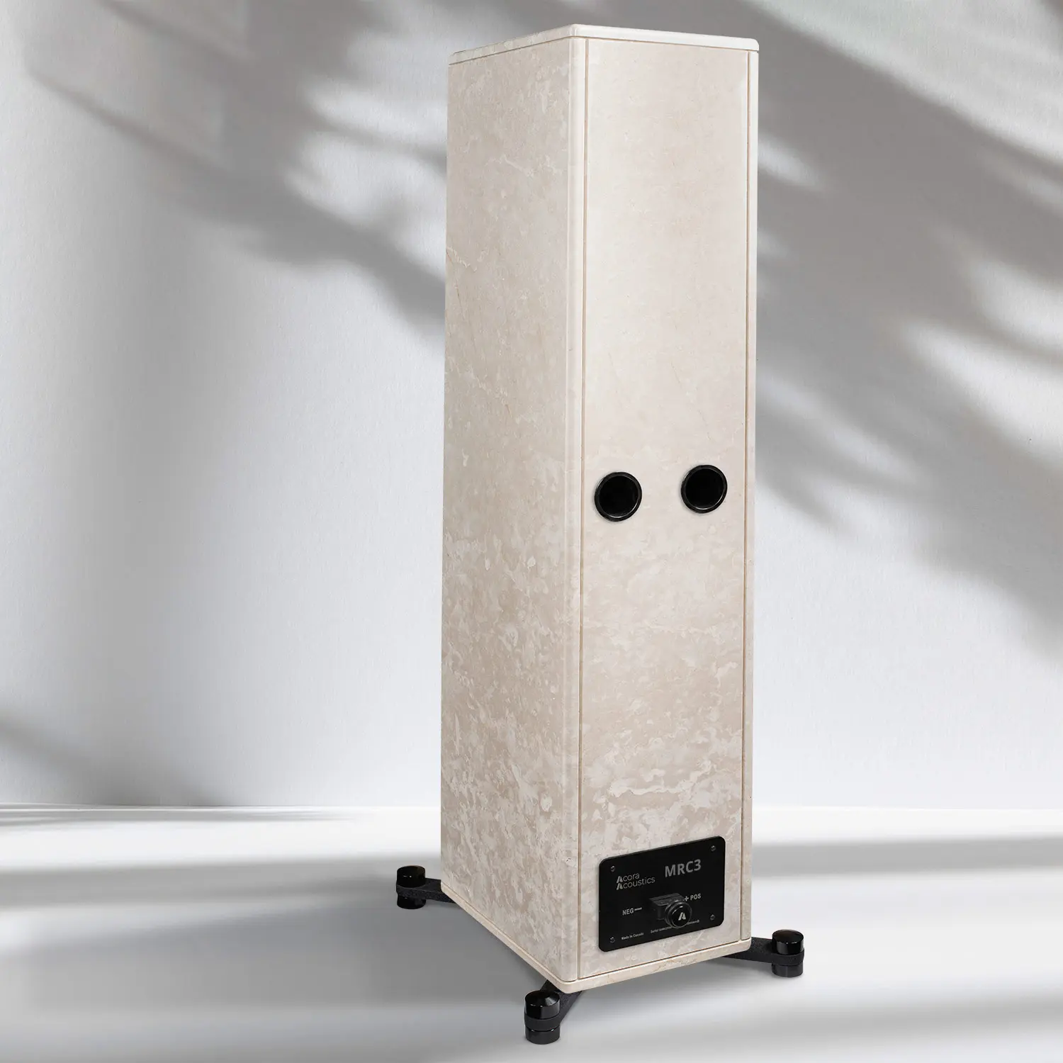 Tall, modern speaker with a textured finish and two circular drivers.