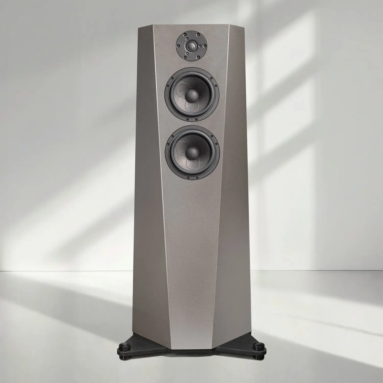 Modern floor-standing speaker with sleek design in natural light.
