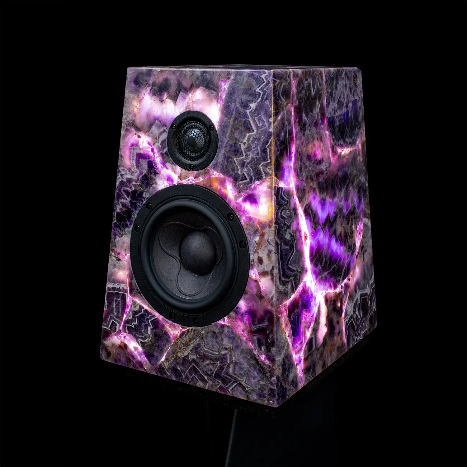 A speaker with a unique purple marble design on a black background.