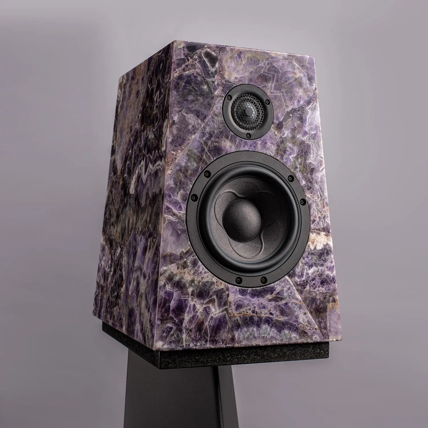 A stylish speaker with a purple, marbled exterior design.