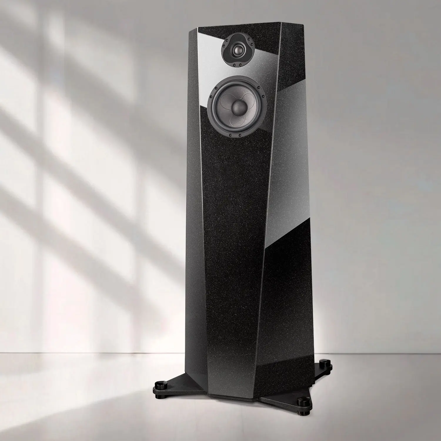 A sleek black floor-standing speaker with a modern design.
