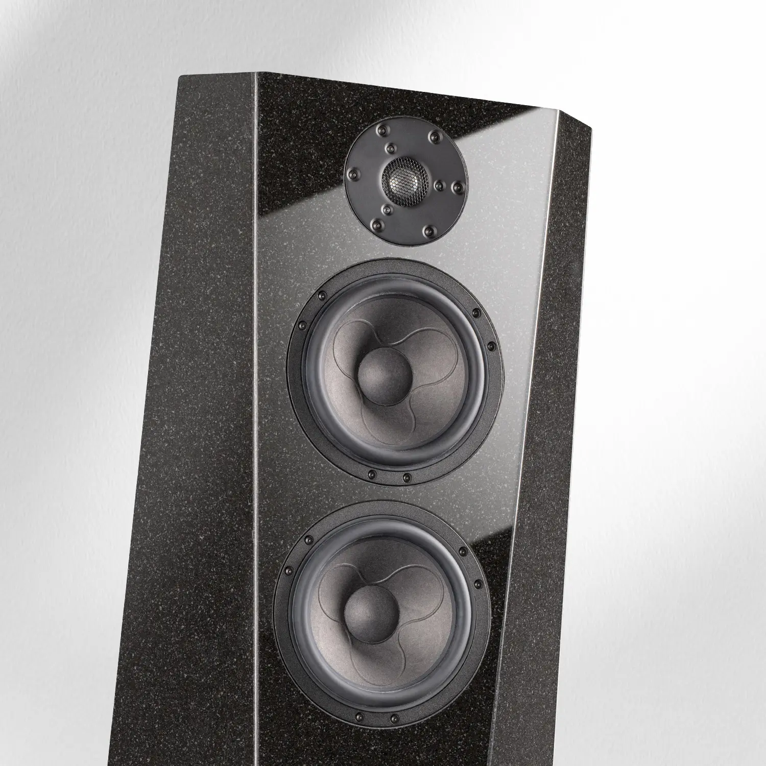 A sleek black tower speaker with three drivers.