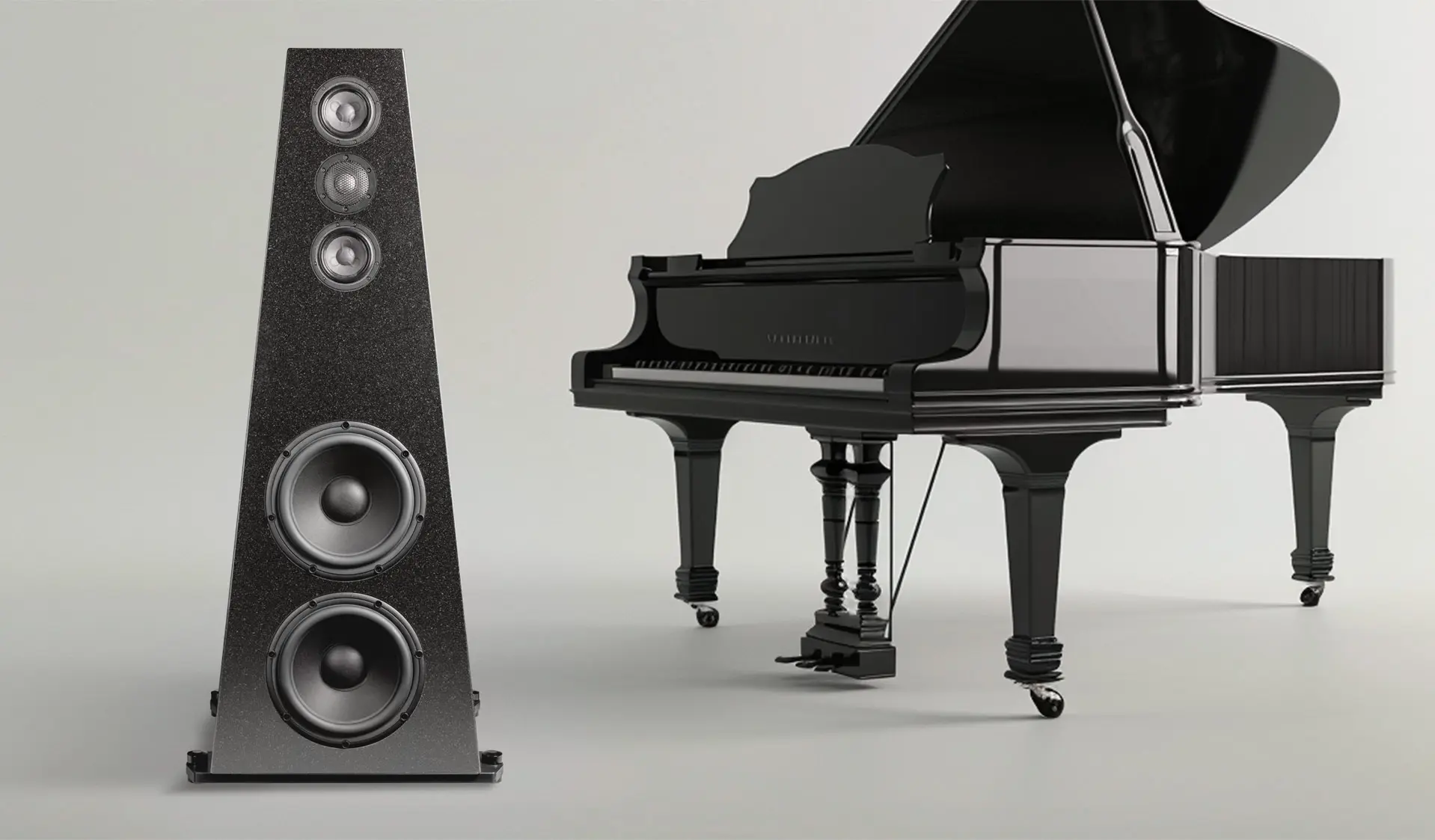A black grand piano next to a modern speaker on a light background.