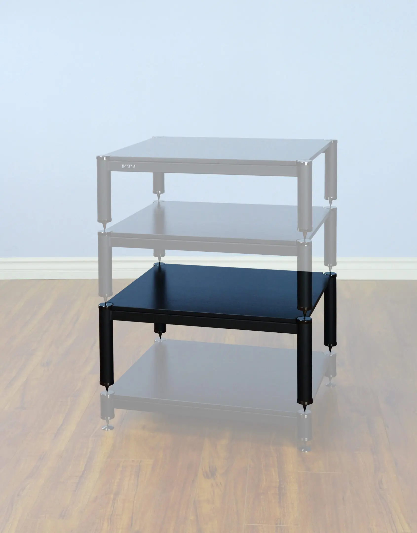 A black glass table with three transparent layers in a room.