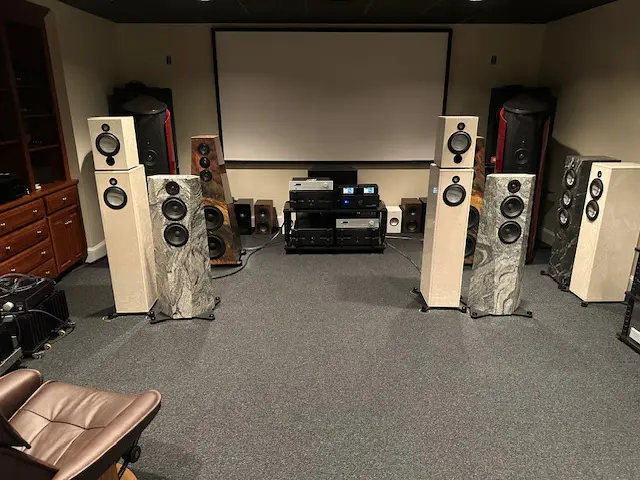 High-end audio speakers set up in a dedicated listening room.