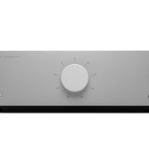 A round white thermostat on a gray wall.